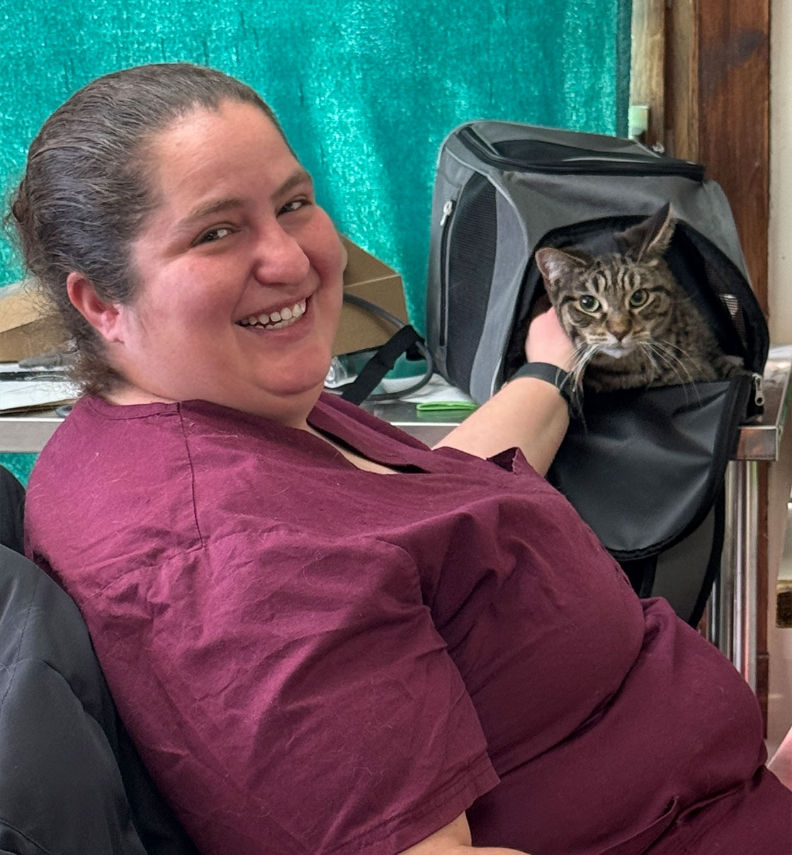women sitting with pet inside