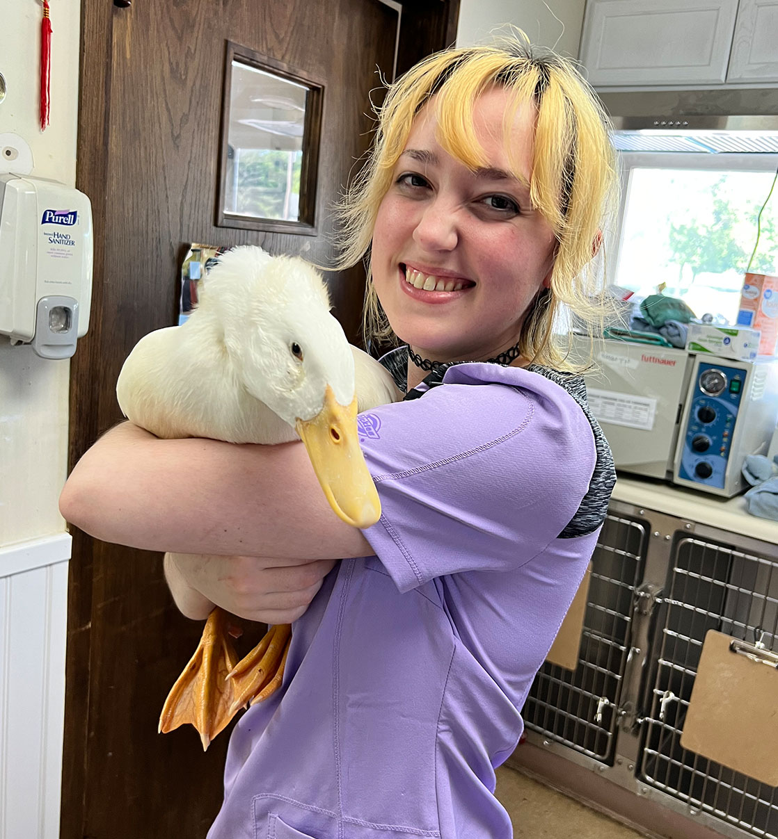 girl holding a duck